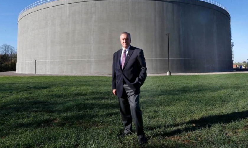 Ron Gilkerson stands in front of Lexington's 22 million gallon Town Branch Wet Weather Storage tank designed by GRW. Photo Courtesy Charles Bertram / Lexington Herald-Leader